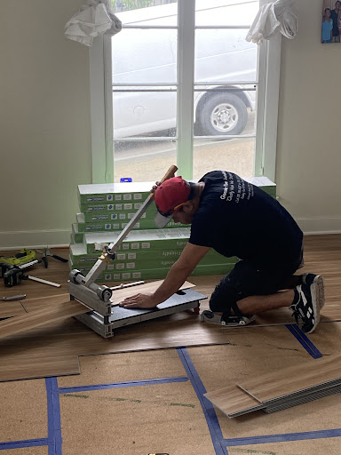 Gonzalez Floor Installations team member cutting flooring